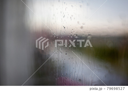 Rainy day through the window on sky and city buildings background 79698527