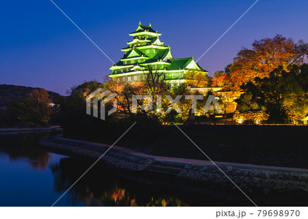 Okayama Castle, aka Ujo or crow castle, by river asahi in japan 79698970
