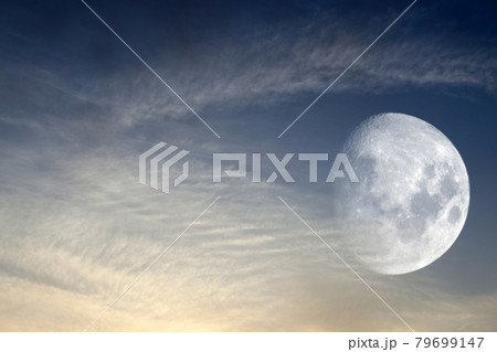 Moon in clouds. Evening sky 79699147