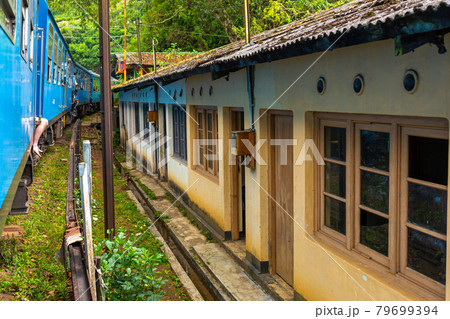 Traveling around the island of Sri Lanka by train. Residential buildings are close to the railroad. Terrible living conditions Traveling around the island of Sri Lanka by train. Residential buildings are close to the railroad. Terrible living conditions 79699394