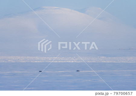 Cars are driving on snow and ice 79700657