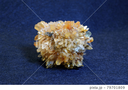 Clouse-up of yellow creedite mineral from Kazakhstan on blue background Clouse-up of yellow creedite mineral from Kazakhstan on blue background 79701809