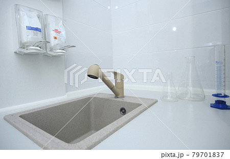 Bathroom at Human Milk Bank laboratory: washbasin, disinfactant with liquid soap, flasks 79701837