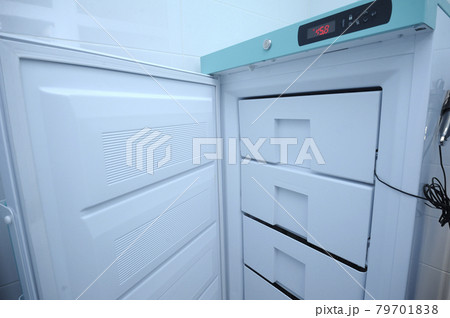 At the Human Milk Bank laboratory. Opened freezer with breast milk storage containers inside 79701838