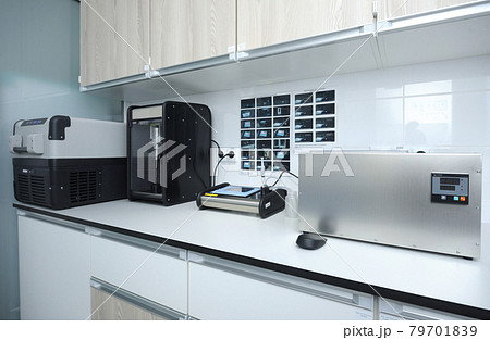 At the Human Milk Bank laboratory. Milk freezer, milk heating box, pasteryzator and milk analizer placed on the table 79701839