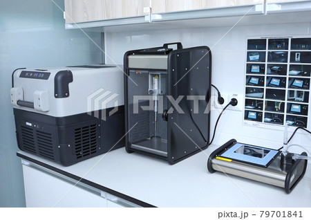 At the Human Milk Bank laboratory. Milk freezer, pasteryzator and milk analizer placed on the table 79701841