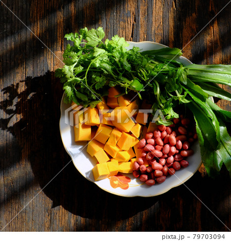 raw material to cook pumpkin soup with peanut and coriander spice, simple dish for Vietnamese vegan meal raw material to cook pumpkin soup with peanut and coriander spice, simple dish for Vietnamese vegan meal 79703094