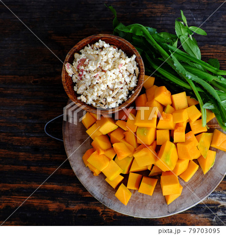 raw material to cook pumpkin soup with peanut and coriander spice, simple dish for Vietnamese vegan meal 79703095