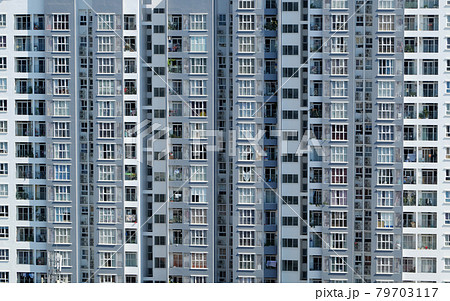 Amazing front of high rise building with many apartment house facade in straght view Amazing front of high rise building with many apartment house facade in straght view 79703117