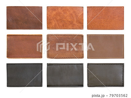 Blank brown leather jeans labels isolated on white background Blank brown leather jeans labels isolated on white background 79703562