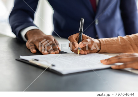 Contract Signing. Female Customer Sign Papers In Dealership Office, Closeup Shot 79704644