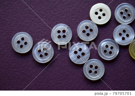 White round buttons on a purple background 79705701