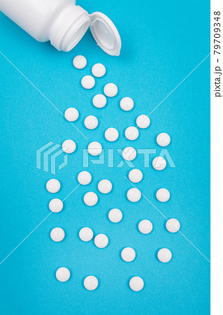 Pharmaceutical Industry and Medicinal Products - White Pills on Blue Background Pharmaceutical Industry and Medicinal Products - White Pills on Blue Background 79709348