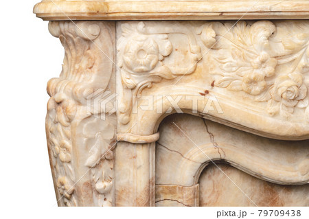 Carved patterns on stone luxury fireplace close up 79709438