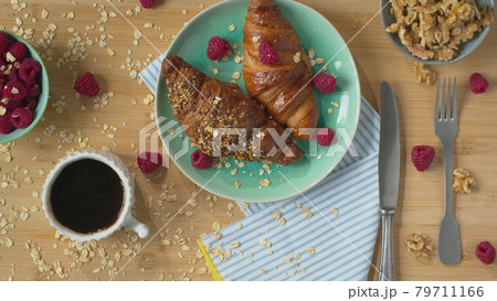 Breakfast with crusty croissants and coffee Breakfast with crusty croissants and coffee 79711166