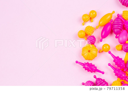 Multicolored plastic beads for a girl's bracelet from a set for needlework 79711358