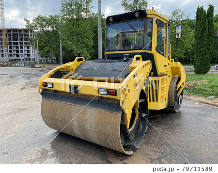 Large view on the road rollers working on the new road construction site Large view on the road rollers working on the new road construction site 79711589