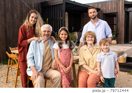 Big Family Standing in Backyard Big Family Standing in Backyard 79712444