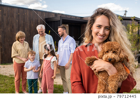 Woman Holding Labradoodle Dog Woman Holding Labradoodle Dog 79712445