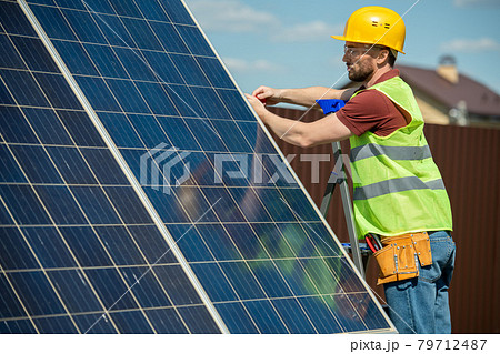 Engineer Installing Solar Panel 79712487