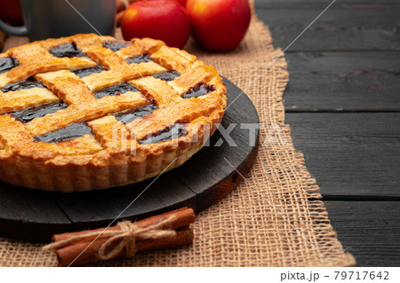 Close up of homemade traditional sweet autumn raspberry tart pie on wooden table 79717642