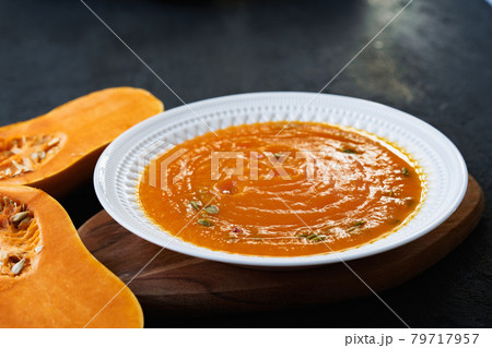 Homemade pumpkin soup on a black table 79717957