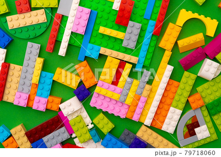 Details of kids plastic constructor on green background Details of kids plastic constructor on green background 79718060