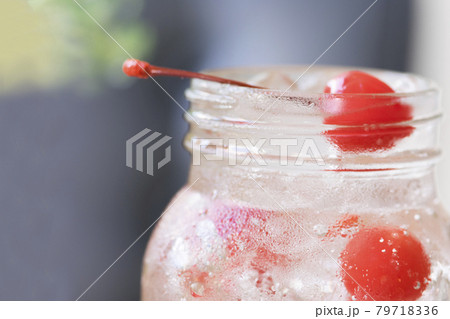 Close up cherry soda in bottle glass 79718336