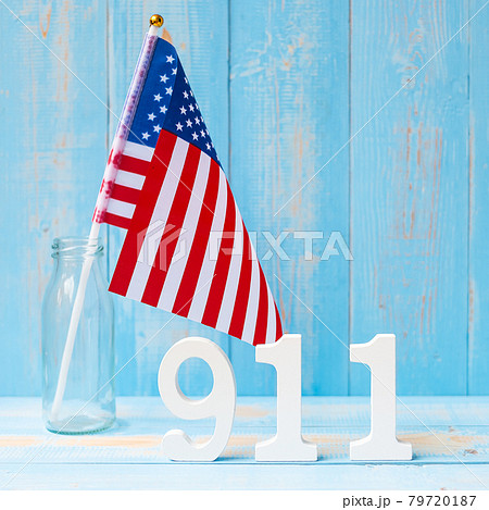 911 text and United States of America flag on wooden table background. Patriot Day, September, memorial and Never Forget concept 911 text and United States of America flag on wooden table background. Patriot Day, September, memorial and Never Forget concept 79720187