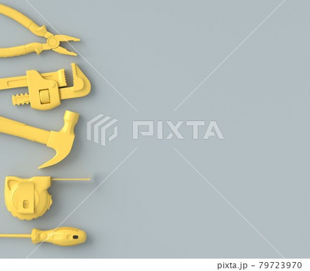 Top view of monochrome construction tools for repair on grey and yellow 79723970