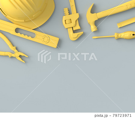 Top view of monochrome construction tools for repair on grey and yellow 79723971