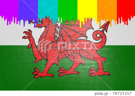 Paint (rainbow flag) is dripping over the national flag of Wales 79725357