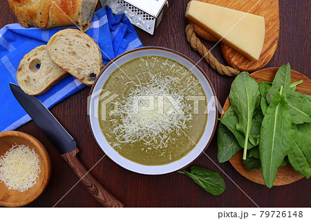 Green spring, summer healthy cream soup of sorrel with parmesan cheese, delicious homemade dinner . Green spring, summer healthy cream soup of sorrel with parmesan cheese, delicious homemade dinner . 79726148