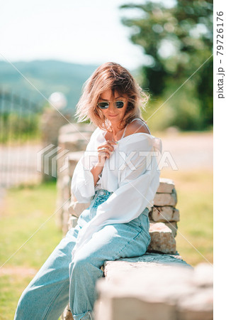 Portrait of young attractive tourist woman outdoors Portrait of young attractive tourist woman outdoors 79726176