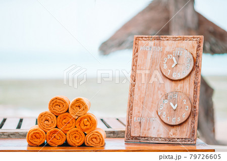 Close up of beach towels near outdoor swimming pool 79726605