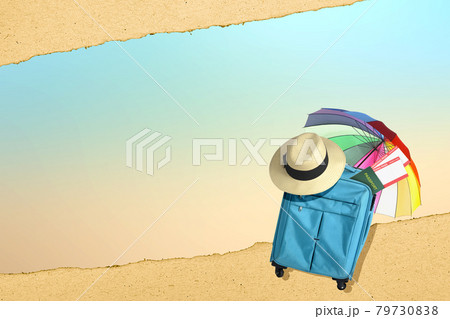 Blue suitcase, hat, ticket, and passport with umbrella Blue suitcase, hat, ticket, and passport with umbrella 79730838