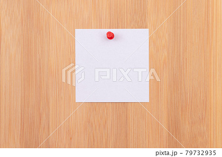 White Sticky Note Pinned to the Wooden Message Board White Sticky Note Pinned to the Wooden Message Board 79732935