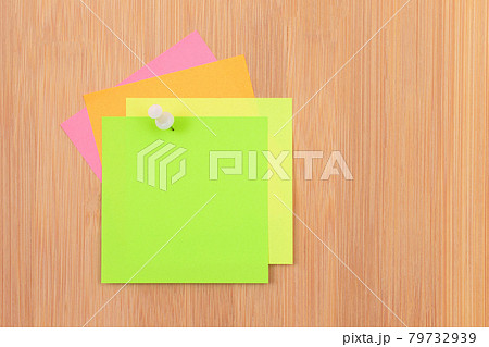 Colored Sticky Notes Pinned to the Wooden Message Board 79732939