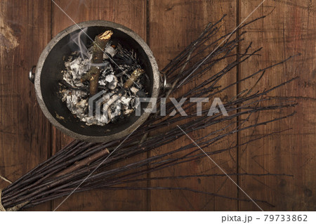 Overhead photo of smoking witch's cauldron with broom and copy space 79733862