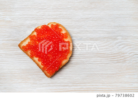 Sandwich with red caviar 79738602