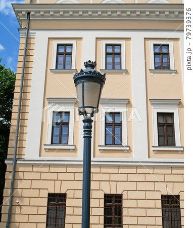 Old style street light in front of the Reformed College in Debrecen city 79739376