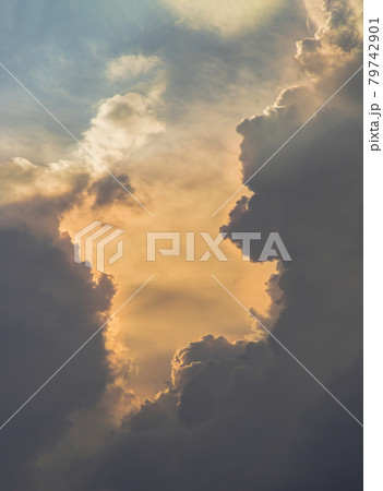 The sun shines through the clouds in the sky.  The shape of the clouds evokes imagination and creativity. They can be used as wallpapers that look amazing. 79742901