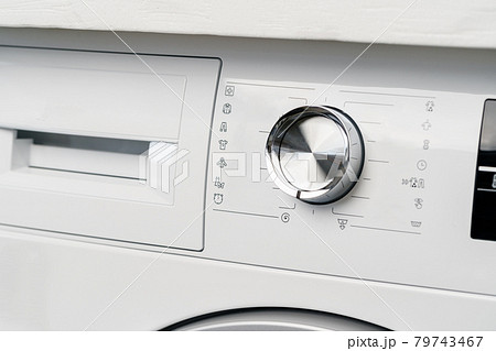 New washing machine in a home appliances store New washing machine in a home appliances store 79743467