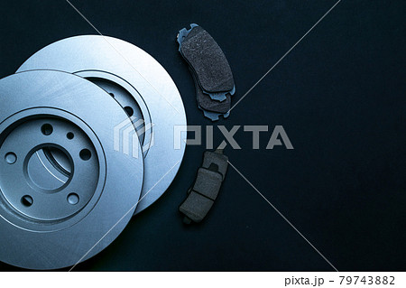 Mechanic part. New metal car part. Auto motor mechanic spare or automotive piece isolated on black background. Automobile engine service with space for text. 79743882