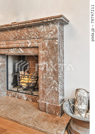 Stylish fireplace in a spacious living room 79747211