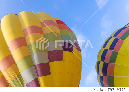 Colorful hot air balloons over blue sky 79749595