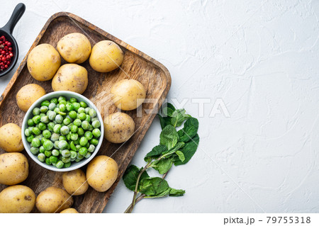 Mashed potatoes ingredients with green pea and mint, flat lay, on white textured background with space for text Mashed potatoes ingredients with green pea and mint, flat lay, on white textured background with space for text 79755318