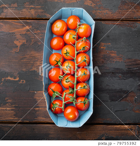 Red ripe cherry tomatoe, on dark wooden background 79755392