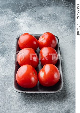 Red ripe tomatoe, on gray background 79755393