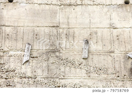 Concrete wall surface with holes and traces of formwork, concrete background 79758769